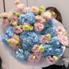 A dreamy combination of pastel pink eustomas and cloud-like blue hydrangeas, Cotton