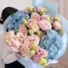 A dreamy combination of pastel pink eustomas and cloud-like blue hydrangeas, Cotton