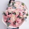 A gentle and elegant mix of soft pink garden roses, creamy carnations