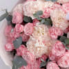 A gentle and elegant mix of soft pink garden roses, creamy carnations