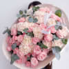 A gentle and elegant mix of soft pink garden roses, creamy carnations