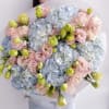 A fresh and airy blend of powder blue hydrangeas and delicate lisianthus