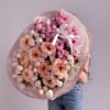 An opulent bouquet of garden roses and spray roses in shades of