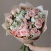 A cute bouquet of fresh spray roses and stock in pink and