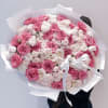 A luxurious medley of vibrant fuchsia, blush pink, and creamy white roses