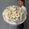 A soft, fluffy cloud in delicate cream tones &mdash; this bouquet is