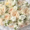 A soft, fluffy cloud in delicate cream tones &mdash; this bouquet is