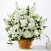 Let this exquisite composition of beautiful white blossoms deliver your sympathy and