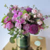 Delight someone special with this elegant arrangement of fresh blush, lavender, and