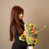 An organic hand tied bouquet that feels like a ray of sunshine.
Designed