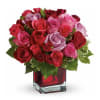 The Raspberry Beret flower arrangement features a lovely assortment of pink and