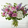 Designed to evoke love and light, the Violet Caress Bouquet features lavender