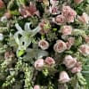 Standing spray of premium pink flowers. 