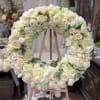 A soft collection of white roses, hydrangea, and other premium accents to