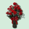 A big, beautiful vase filled with two dozen premium red roses complete