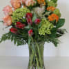 Some of the flowers in the arrangement are seasonal. Please call to
