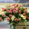 Peach &amp; white roses, stock, gladiolas, carnations &amp; daisies arranged beautifully for