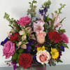 A spring mix of flowers to match a stunning vase for moms.