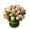 A simple and modern white and peach or pink rose arrangement showcases