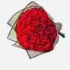 100 Red Roses in lovely wrapping paper.
Paper will always be black unless