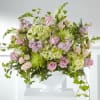 Elegantly crafted with an array of pink and green blooms, this bouquet