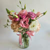 A stunning pink and lavender floral arrangement brimming with elegance and softness.