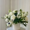 Gracefully Elegant is a modern and compact white arrangement filled with imported
