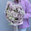 Charming bouquet of delicate pink lisianthus and pink garden roses with beautiful