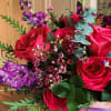 This vibrant bouquet radiates passion and elegance with its stunning combination of