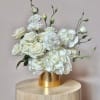 &quot;Golden Radiance&quot; is a sophisticated floral arrangement that effortlessly blends modern minimalism