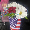 fresh flowers in American flag container 