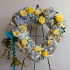 Fresh floral arrangement in the shape of heart. Used for funeral or