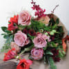 This assortment of seasonally sourced blooms is ready for your vase. Hand