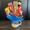 Congratulate graduates with sweet candy arrangement and mug!