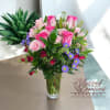 Bright and full of grace, this lovely arrangement features dark pink roses