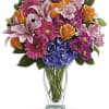A tender mix of blooms that feel like a warm embrace- this