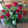 A timeless expression of love, this stunning arrangement features a dozen premium