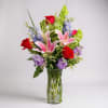 The &quot;Beautiful Garden Vase&quot; features a delightful mix of soft pink lilies