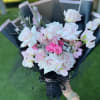 This artfully arranged bouquet is made with soft pinks.  Offering a