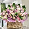 Baby Girl Flower Basket: Accented with hydrangeas, daisies, greens, and roses.