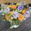 A lovely flower arrangement with lavender stock and violet clematis, anemone when