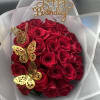 24 Fresh Long Stem Premium Red Roses wrapped. 