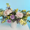 Let tranquility bloom with Whispering Meadow &mdash; a soft, romantic arrangement inspired