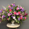 A heartfelt expression of love and remembrance, Magenta Sunset features graceful purple