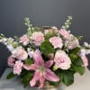 Blushing Grace is a tender and elegant arrangement filled with soft pink