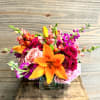 A mix of bright summer blooms in shades of pinks and oranges.