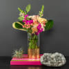 Sunny bright blooms in an upgraded vase with fun aspidistra leaves making