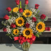 A dozen of roses with sunflowers. Sure to bring a smile to