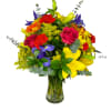 Features red roses, yellow lilys, delphiniums