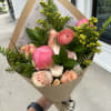 Add a touch of elegance with this hand-wrapped bouquet, featuring a soft